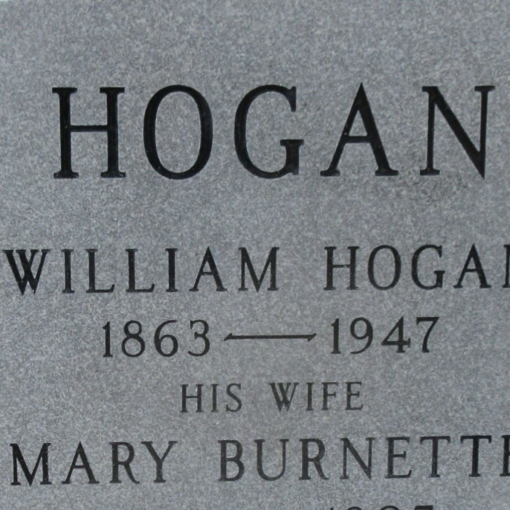 An example of sandblast-sunken lettering, which presents dark lettering on a lightly coloured granite.