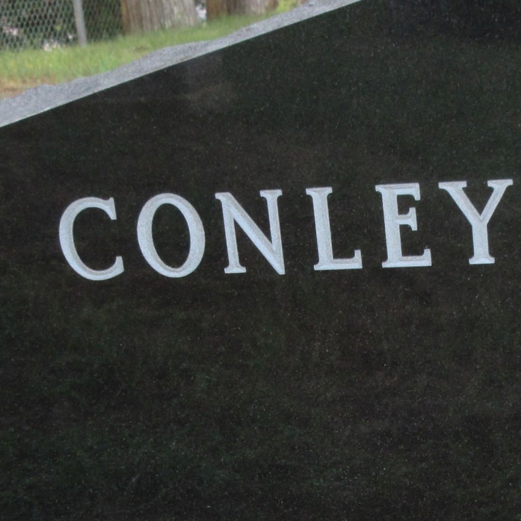 An example of v-sunk lettering which appears white on a black or dark granite.